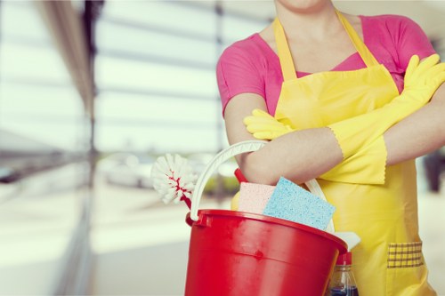 Cleaner refreshing a short-let kitchen in Pimlico